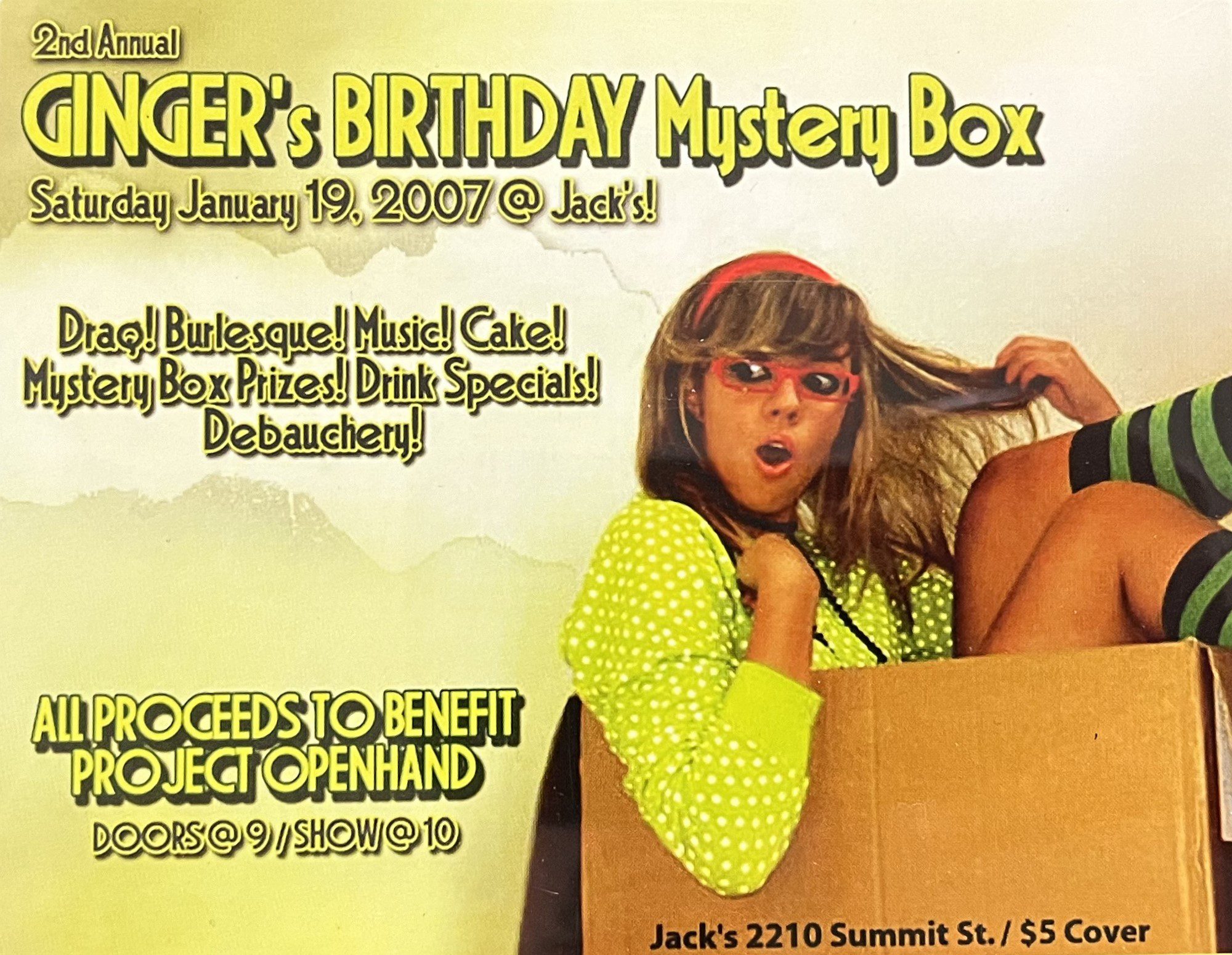 Color advertisement for Ginger's Birthday Mystery Box featuring a woman in a cardboard box
